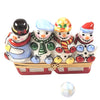 Snowmen on a red sled with a snow-covered forest background