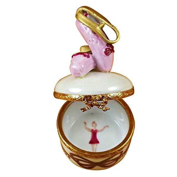 Ballet shoes with pink satin ribbons on a round background 