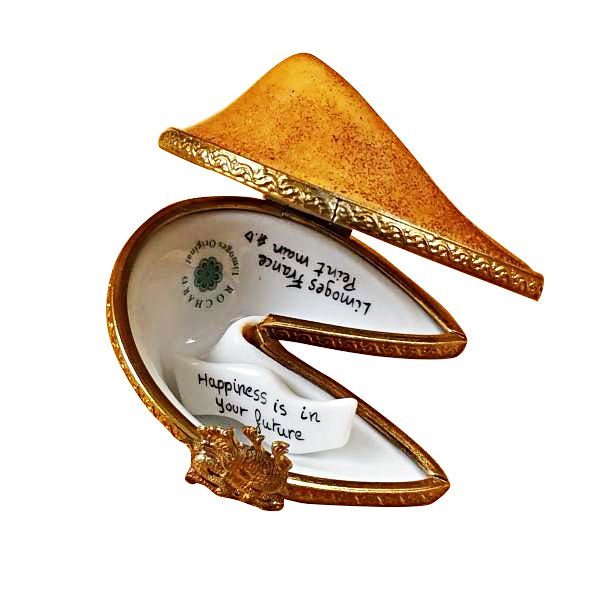 Fortune cookie with a crispy golden exterior and a white fortune paper inside 
