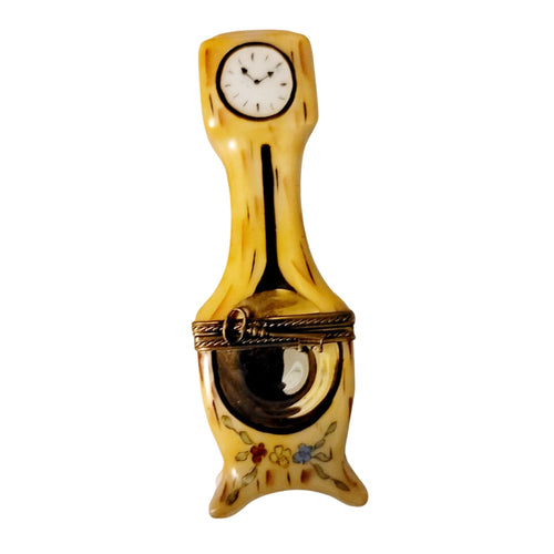Grandfather clock with dark wood finish and intricate carvings 