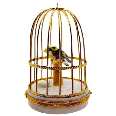 Charming Limoges figurine box with realistic tanager birds in a cage design