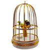 Handcrafted Limoges figurine box with intricate details of tanager birds in a cage