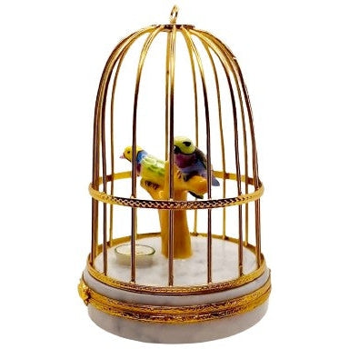Handcrafted Limoges figurine box with intricate details of tanager birds in a cage