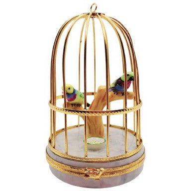 Beautifully painted porcelain figurine box featuring tanager birds in a cage