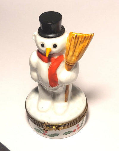 Beautifully crafted snowman with a broom in hand