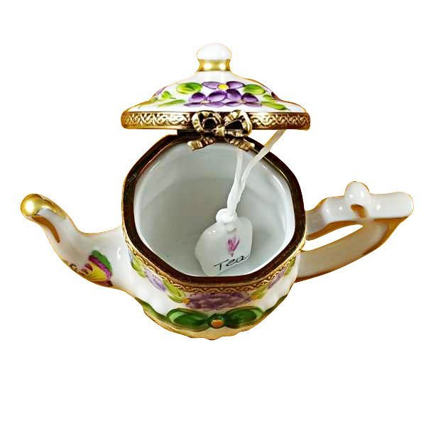 Teapot with elegant butterfly design 