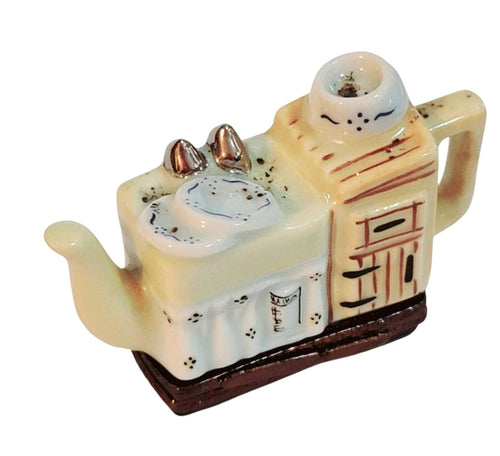 Yellow kitchen sink teapot with a modern and sleek design 