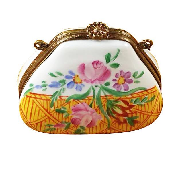 Yellow purse with gold chain strap and floral pattern on front 