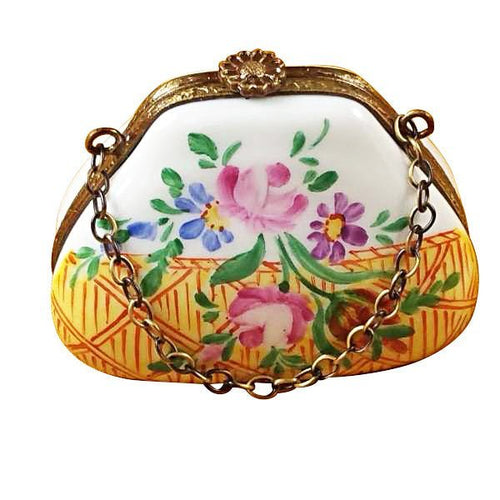 Yellow purse with gold chain strap and floral pattern on front 