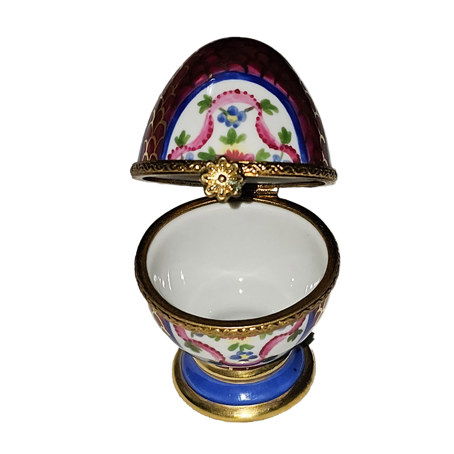 Maroon Egg on Golden Pedestal