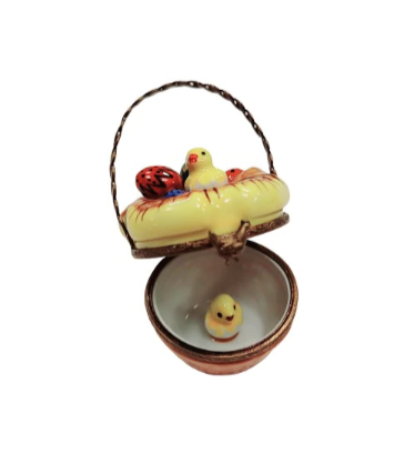 Easter basket with colorful eggs and a bird sitting on top