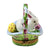 White rabbit figurine with long ears and pink nose sitting in a colorful Easter basket surrounded by wisteria flowers and greenery Limoges box
