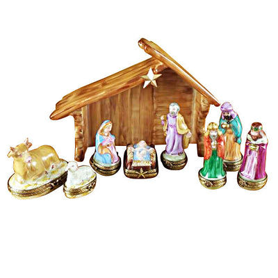 Eight Piece Mini hinged Nativity w Stable figurines in a rustic stable setting
