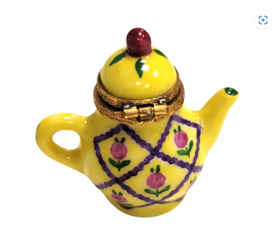 Traditional yellow teapot with a spout and a sturdy base for brewing