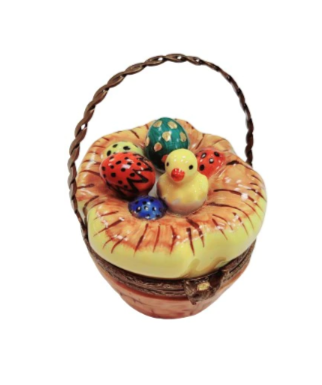 Easter basket with colorful eggs and a bird sitting on top