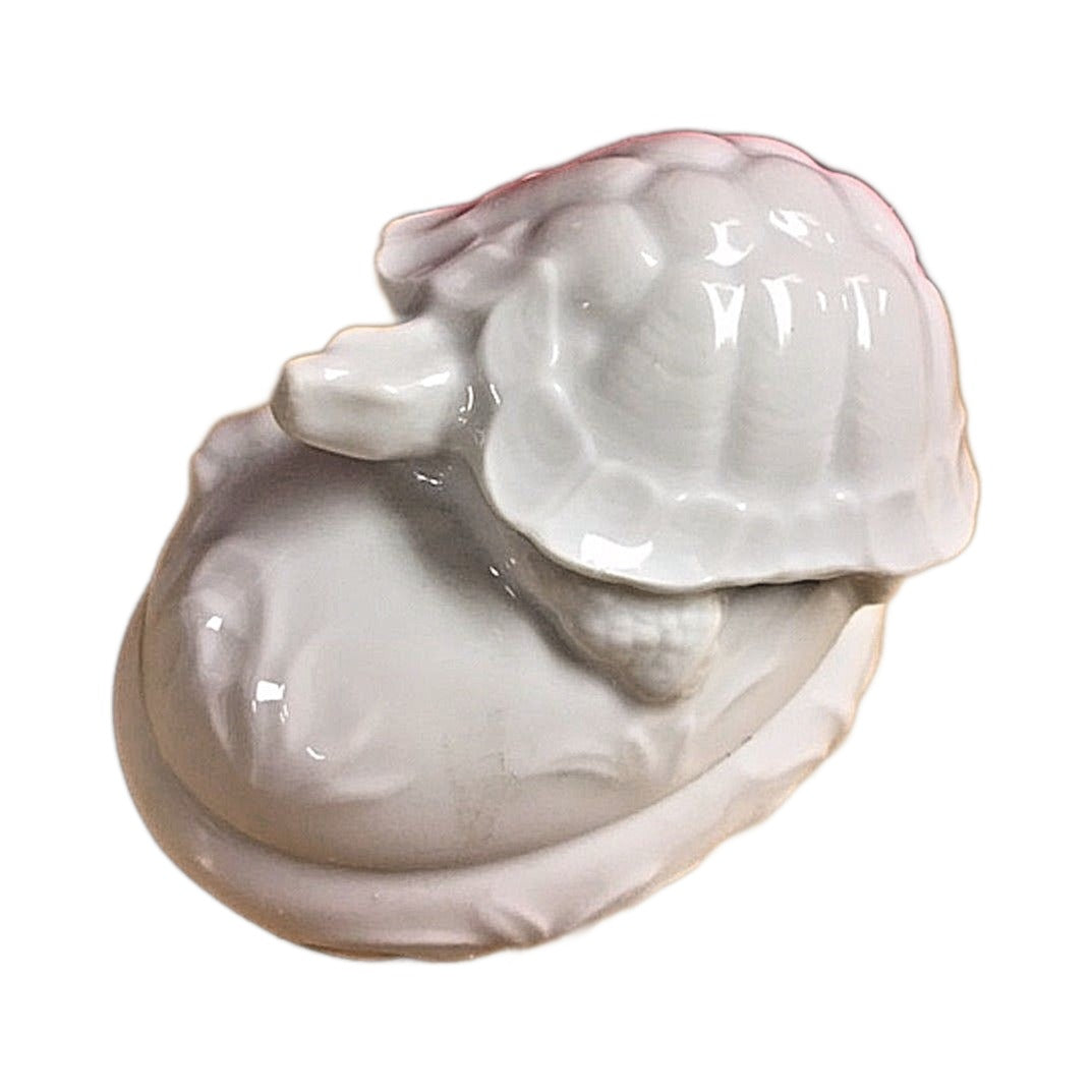 Side view of the tortoise Limoges box, white porcelain with a lift-off lid