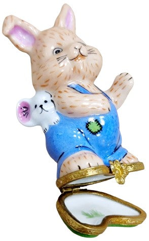 A fluffy white bunny rabbit with a cute mouse friend sitting together
