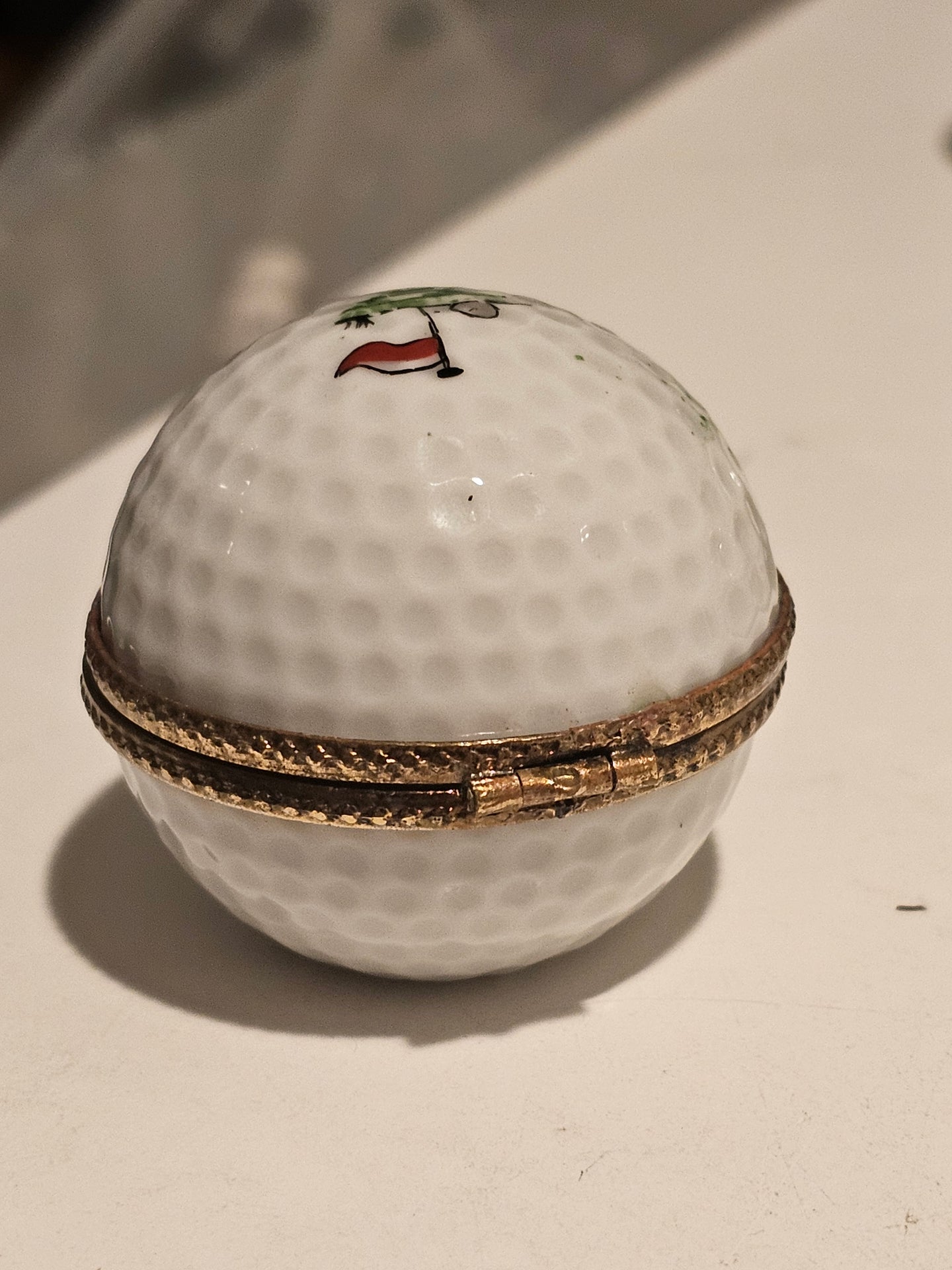 White Golf Ball with Hole Flag Inside