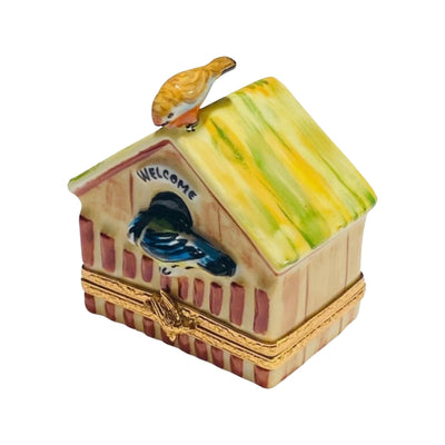 Colorful birdhouse with vibrant paint and shingled roof