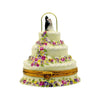 Traditional wedding cake adorned with roses and intricate piping details