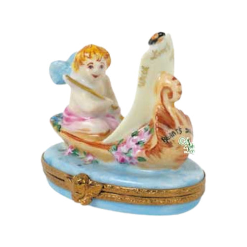 Alt text: Romantic Cupid In Gondola porcelain figurine, handcrafted with intricate detailing and featuring a cherub steering a gondola, perfect for adding a touch of love and elegance to your home decor