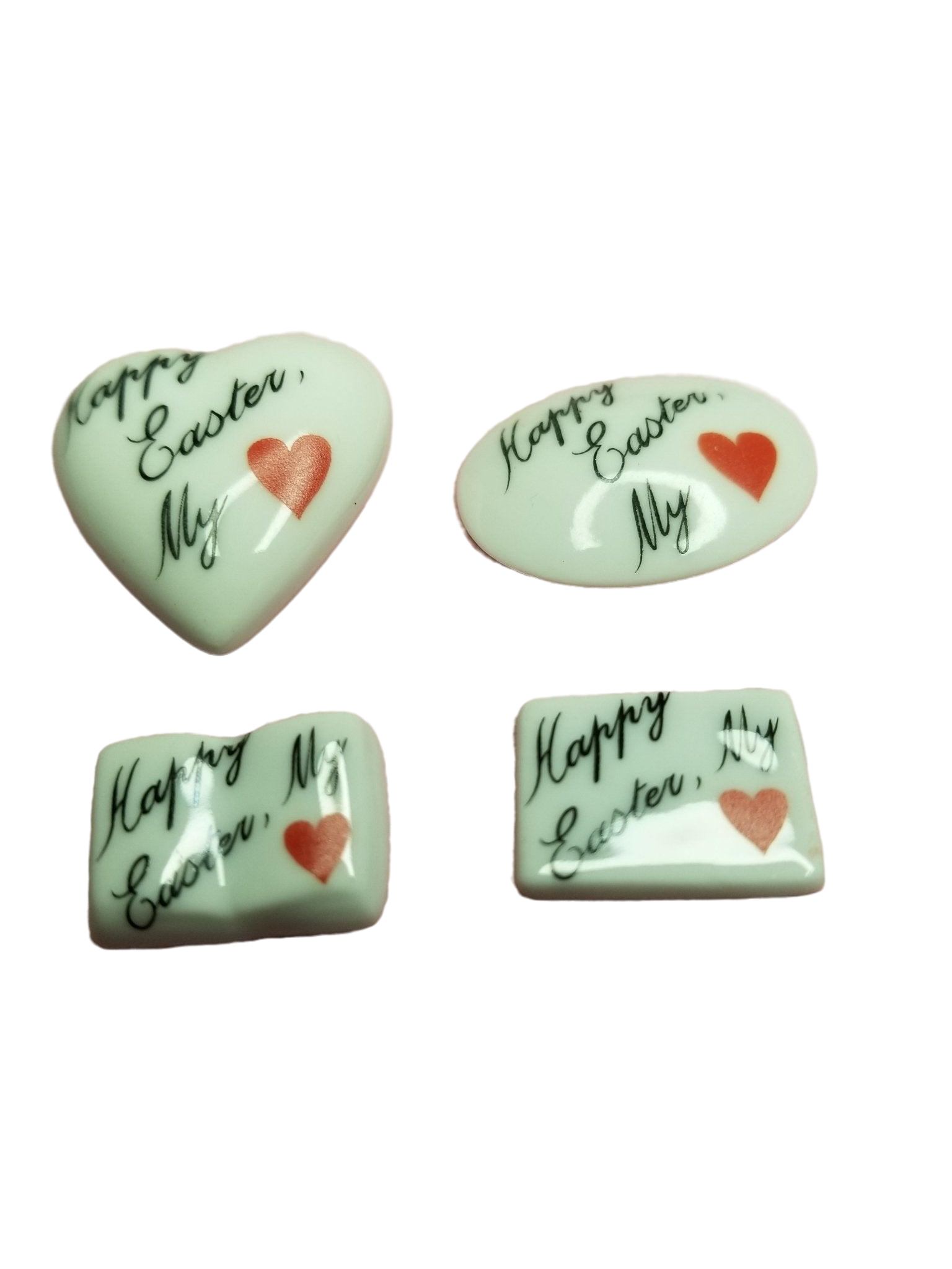 Colorful chocolate Easter eggs arranged in a heart shape with a tag that says 'Happy EASTER My Love - Goodie'