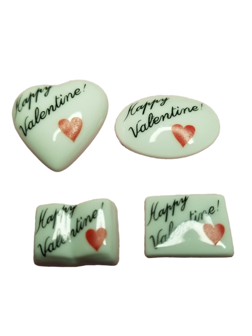 Colorful heart-shaped candies in a transparent box with 'Happy VALENTINE - Goodie' written on it, perfect for Valentine's Day gifting and celebrations