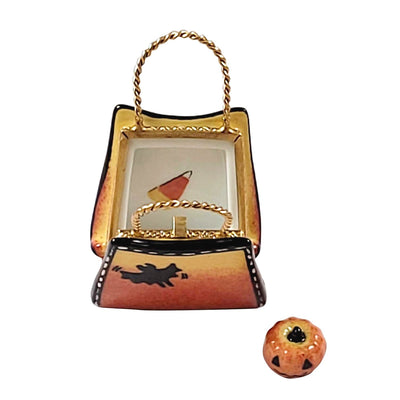 Cute Halloween bag filled with assorted candies and a pumpkin toy