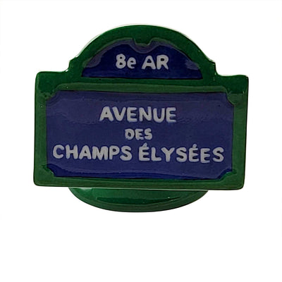 Iconic Parisian street sign with elegant design and classic blue color