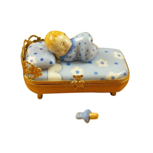 Baby in Blue Bed with Pacifier