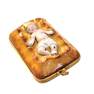 Hand-painted-resin-sculpture-depicting-the-infant-Jesus-in-a-manger