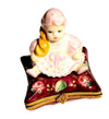 Blond Haired Baby Girl Doll on Pillow