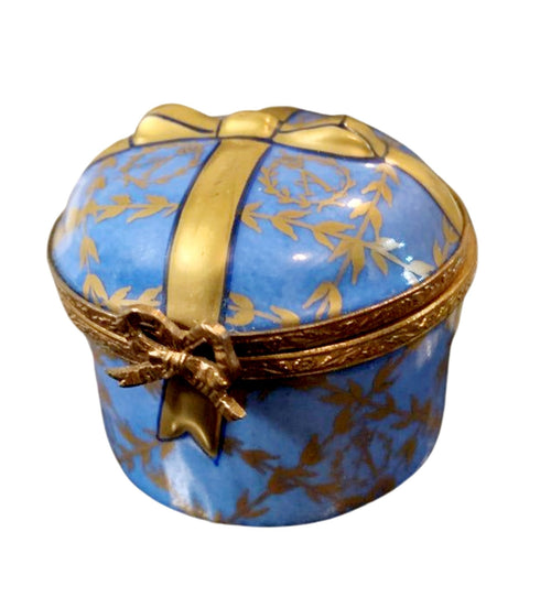 A beautiful round blue gift box with a ribbon and bow
