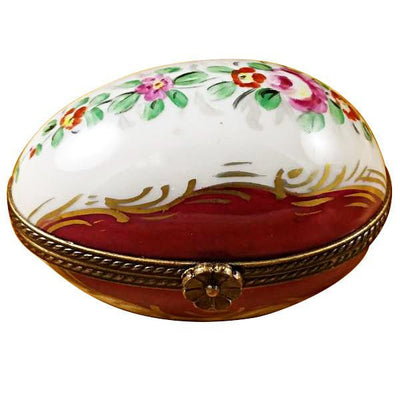 Burgundy egg with intricate floral design and gold accents