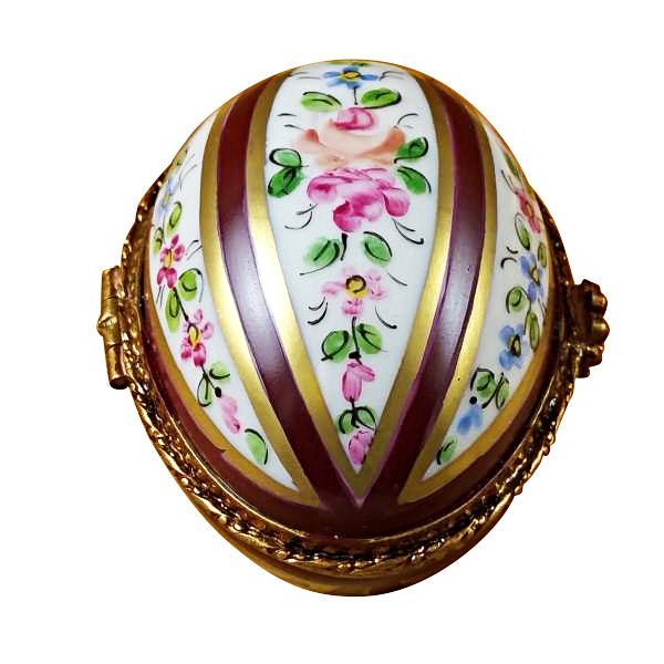 Hand-crafted burgundy-striped egg with delicate gold patterns