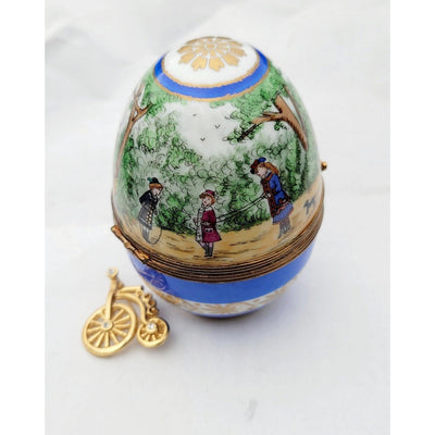 Children Playing At Park in Paris Blue Limoges Porcelain Egg w Unicycle Trinket Box - Limoges Box Boutique