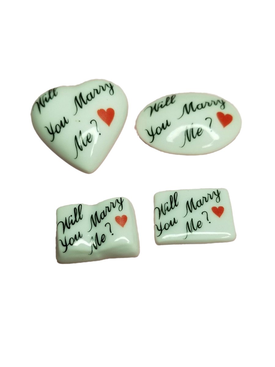 Beautiful and elegant diamond engagement ring with the words 'Will You MARRY Me' engraved on the band, perfect for a romantic proposal