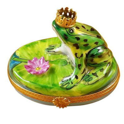 Frog wearing a golden crown sitting on a lily pad