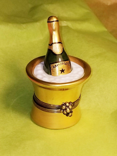 Exquisite Limoges gold champagne bucket filled with ice cubes