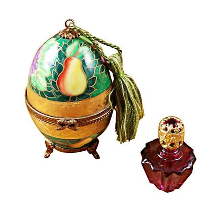 Green and gold hand-painted egg with intricate designs and one bottle of matching color