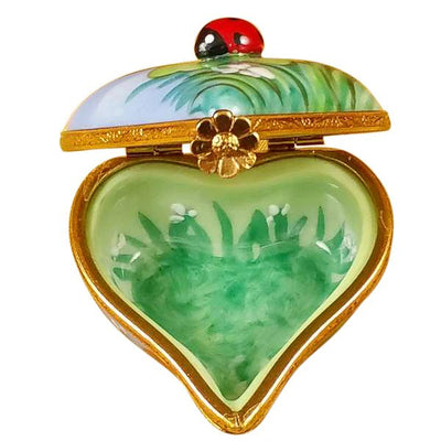 Cute ladybug ornament perched on a heart with a bright red hue