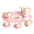A beautiful pink mini tea set with teapot, cups, saucers, and spoons