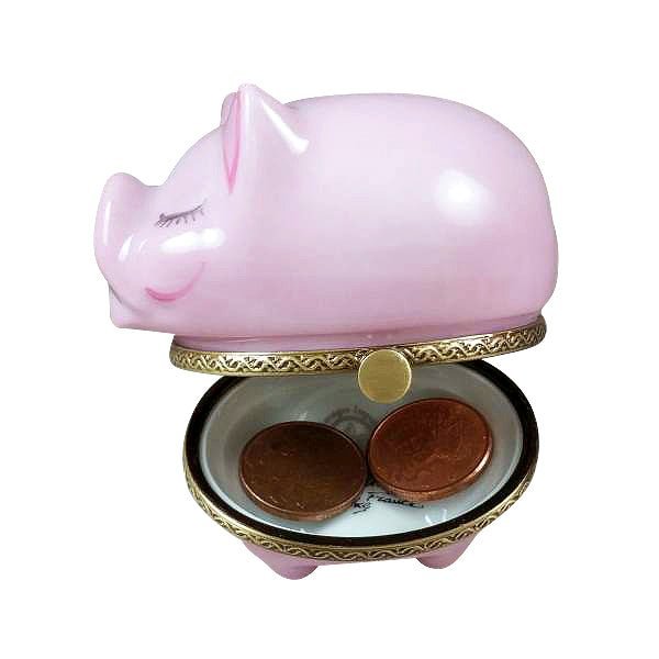 Pink piggy bank with a slot for inserting and removing coins