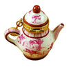 Vintage-inspired porcelain teapot in soft pink with intricate design