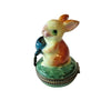 Decorative sculpture of a rabbit with a watering can