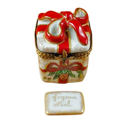 Red-ribbon Christmas box with plaque, ideal for gifting presents
