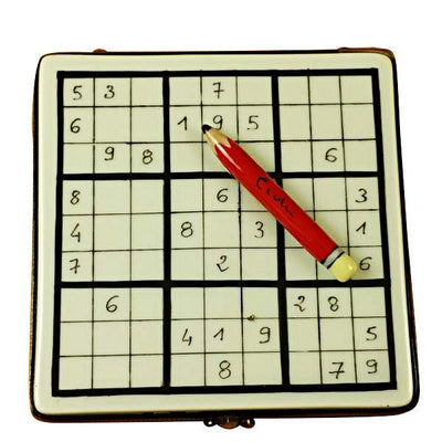 Close-up of hand solving Sudoku puzzle with pencil