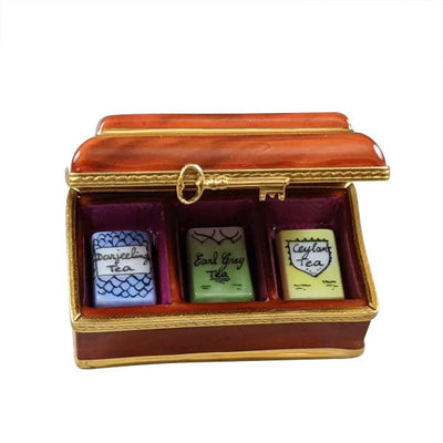 A wooden tea box with compartments for 3 different tea bags
