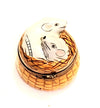Two adorable brown and white rats sitting side by side in a small woven basket