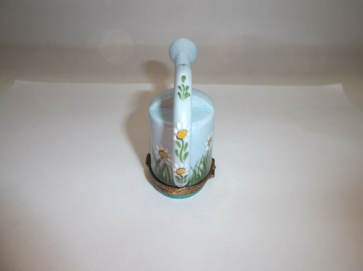 A charming watering can with delightful daisy motif